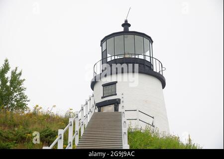 Owls Head light (1825 - present tower 1856)  on a foggy morning in Owls Head, Maine, USA Stock Photo