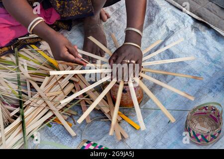 KOLKATA, WEST BENGAL , INDIA - DECEMBER 14TH 2013 : Unidentified woman making wicker baskets , handicrafts on display at Handicraft Fair in Kolkata. Stock Photo