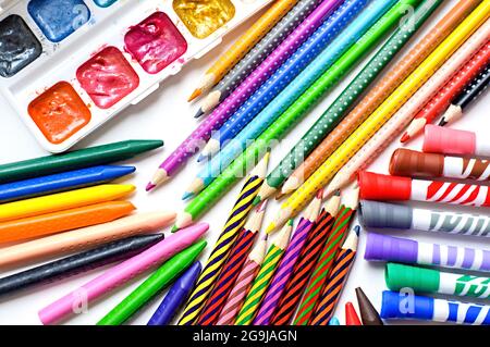 Subjects for drawing. Colored pencils, crayons, markers and paints on white background Stock Photo