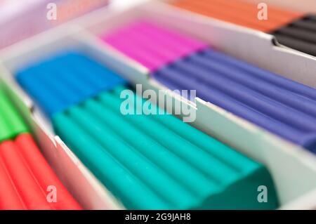 Box with children's colorful plasticine. blurred Background Stock Photo