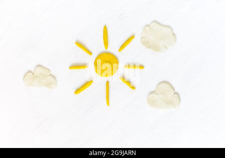 Sun and clouds on sky made from plasticine Stock Photo