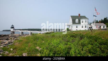 Marshall Point Lighthouse (1832 present tower 1857) and keepers house in Port Clyde, Maine.  Was a scene in the movie Forest Gump. Shows keepers house Stock Photo