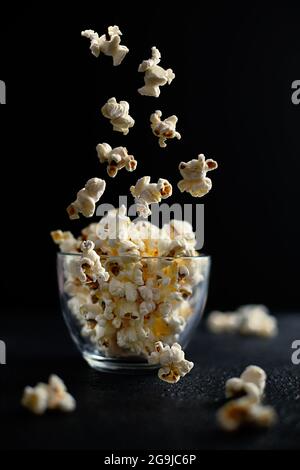 Creative concept with falling food on black backdrop Stock Photo