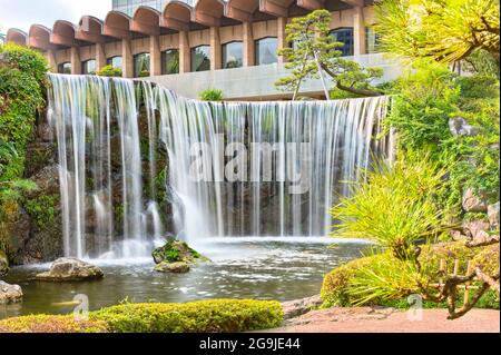 tokyo, japan - july 25 2021: Closeup long exposure on the big waterfall of the Hotel New Otani famous for its Japanese Garden in the kioi district. Stock Photo