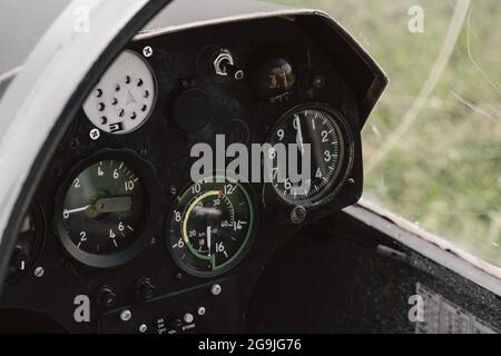 Pilot prepares for flight and checks the aerometric instruments altimeter artificial horizon heading indicator airspeed indicator, variometer. Glider Stock Photo