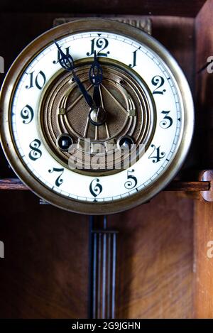 Fragment of antique wall clock with pendulum Stock Photo