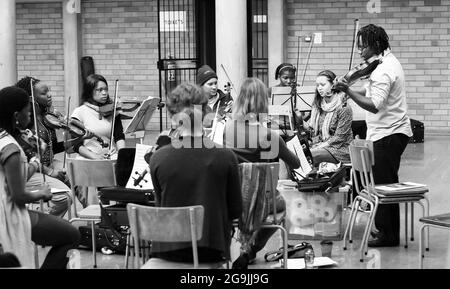 JOHANNESBURG, SOUTH AFRICA - Jan 05, 2021: Diverse youth at music school orchestra in Johannesburg, South Africa Stock Photo