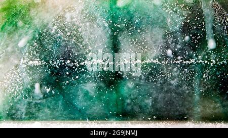 Multicolored ice plate melting, colors overflowing Stock Photo