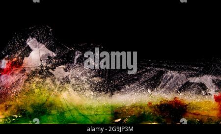Multicolored ice plate melting, colors overflowing Stock Photo