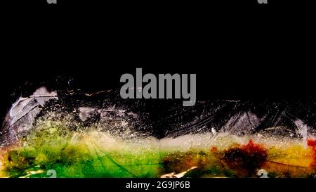 Multicolored ice plate melting, colors overflowing Stock Photo