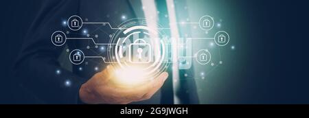 Hand of businessman holding virtual lock icon while cyber security, access data and privacy with protection digital, innovation of system protect for Stock Photo