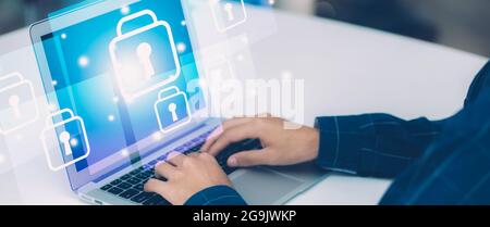 Digital network and cyber security for safe and privacy about data, businessman using laptop computer while display futuristic virtual lock guard for Stock Photo