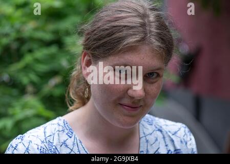 Portrait of a young woman with freckles, Germany Stock Photo