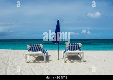 Sun loungers on world class Shoal Bay East beach, Anguilla, Caribbean, British Oversea territory, United Kingdom Stock Photo