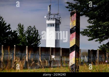 View from Ponit Alpha of the former German-German border, border barrier with observation tower of the GDR border troops, border watchtower, guide Stock Photo
