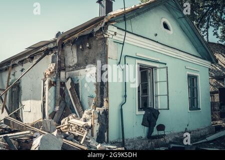Ruined abandoned residential building. Collapsed ruins of house. Stock Photo