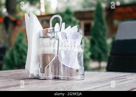 Napkins, pepper and toothpicks in metal coaster.  Stock Photo