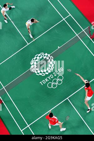 Tokyo, Japan. 27th July, 2021. Li Junhui/Liu Yuchen of China compete with Kamura Takeshi/Sonoda Keigo of Japan during the men's doubles badminton group match at the Tokyo 2020 Olympic Games in Tokyo, Japan, July 27, 2021. Credit: Li Yibo/Xinhua/Alamy Live News Stock Photo