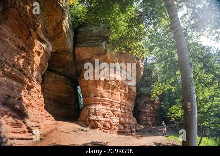 Hiker at Old Castle Rock (Altschlossfelsen), red sand stone towers in the Palatine forest, Eppenbrunn, Rhineland-Palatinate, Germany Stock Photo