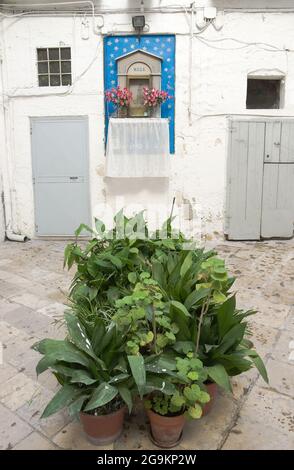 Bari, Italy - July 19, 2012: in the courtyard of Old Bari a votive shrine testifies to the popular devotion to the Madonna Stock Photo