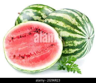 Ripe big watermelon with slices and watermelon leaves isolated on white background. Stock Photo