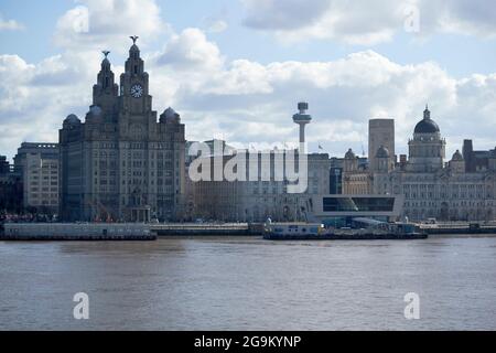 three graces building and mersey ferry terminal liverpool city centre skyline viewed across the river mersey from birkenhead liverpool england uk Stock Photo