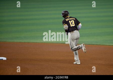 San Diego Padres third basemen Manny Machado (13) hits a home run during an MLB regular season game against the Miami Marlins, Sunday, July 25, 2021, Stock Photo