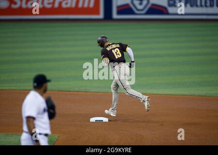 San Diego Padres third basemen Manny Machado (13) hits a home run during an MLB regular season game against the Miami Marlins, Sunday, July 25, 2021, Stock Photo