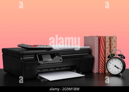 Compact home laser printer against pink background Stock Photo