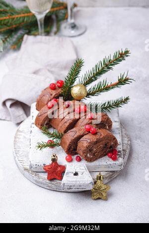 Christmas chocolate roll cake with cream Stock Photo