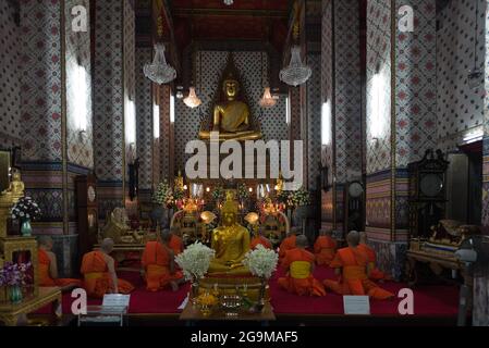Buddhist monks celebrate dawn prayers at Wat Arun, in Bangkok, Thailand. Stock Photo