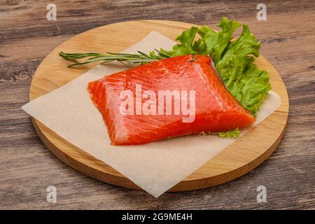 Salted Salmon piece steak served rosemary Stock Photo