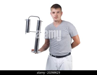 Photo of young man with bristle holding moonshine distiller Stock Photo