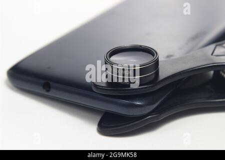 Additional Lens Macro and Wide attached to Smartphone, for super wide photography at white background Stock Photo