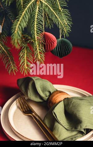 Christmas table setting in blue, golden and whitec olors on grey