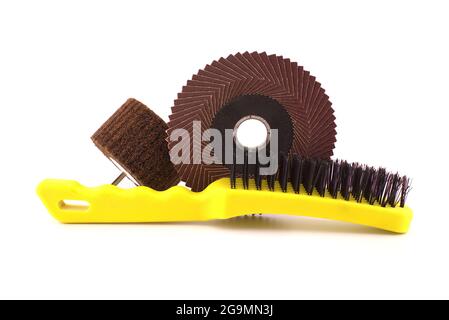 Set of different tools for grinding - metal wire bristle brush, abrasive wheel and flap disc for angle grinder, isolated on white background Stock Photo