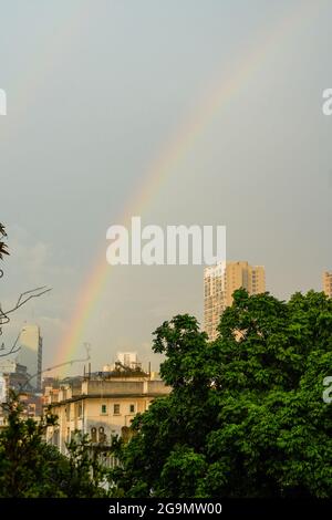 A double rainbow appeared over the city after the rain Stock Photo - Alamy