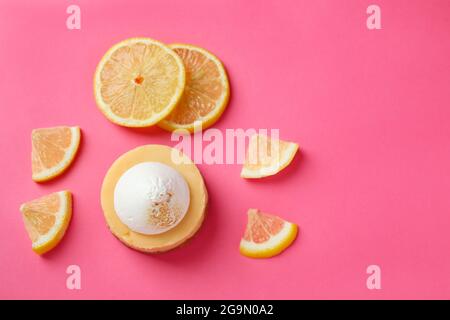 Lemon cupcake and lemon slices on pink background Stock Photo