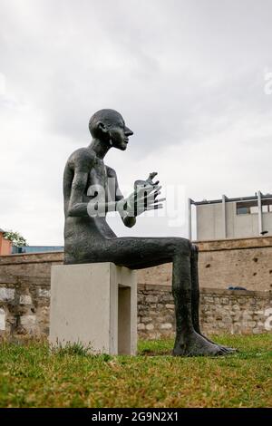 July, 2021, Erfurt Germany, Man with an animal, a new sculpture in Erfurt Stock Photo