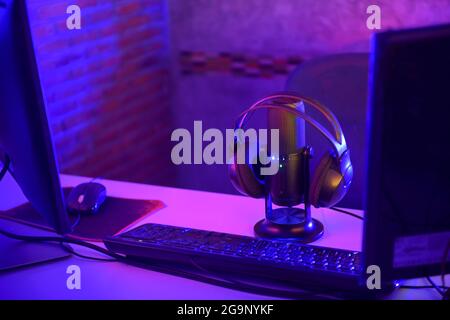 Podcasts and Stream. Flat lay. Studio condenser microphone black with professional headphones, top view with space for design at night. Stock Photo