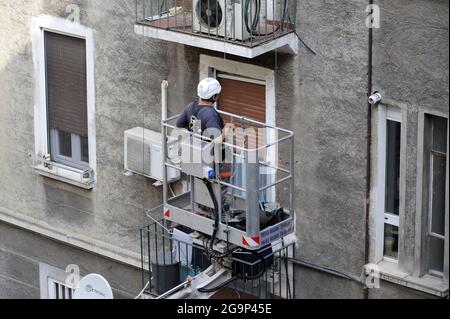 Milan (Italy), maintenance facade of a building Stock Photo