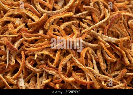 Preserved bitter orange peel close up isolated on white background Stock Photo