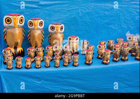 KOLKATA, WEST BENGAL , INDIA - NOVEMBER 23RD 2014 : Wooden owls, artworks of handicraft, on display during Handicraft Fair in Kolkata - the biggest ha Stock Photo