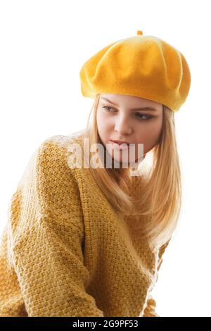 portrait of a young woman in a yellow beret, isolate on a white background Stock Photo