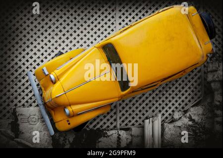 Retro Car. Luxury yellow vintage automobile on the black and white background. Stock Photo