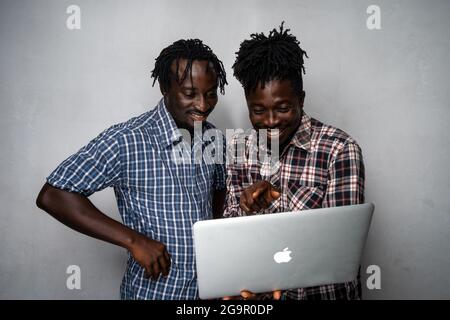 Two Men with a Laptop Stock Photo