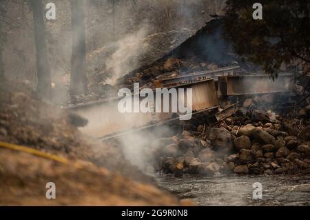 Plumas County, USA. 21st July, 2021. A small bridge left damaged by the Dixie fire is seen off of Caribou Road on July 21, 2021, in Plumas County, Calif. (Photo by Xavier Mascarenas/The Sacramento Bee/TNS/Sipa USA) Credit: Sipa USA/Alamy Live News Stock Photo