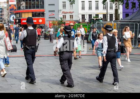London, UK. 27th July, 2021. Metropolitan Police officers patrolling in Leicester Square, London. (Credit Image: © Dave Rushen/SOPA Images via ZUMA Press Wire) Stock Photo