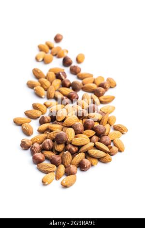 Peeled hazelnuts and almonds isolated on white background. Stock Photo