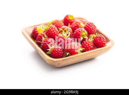 Fresh red raspberries in bowl isolated on white background. Stock Photo